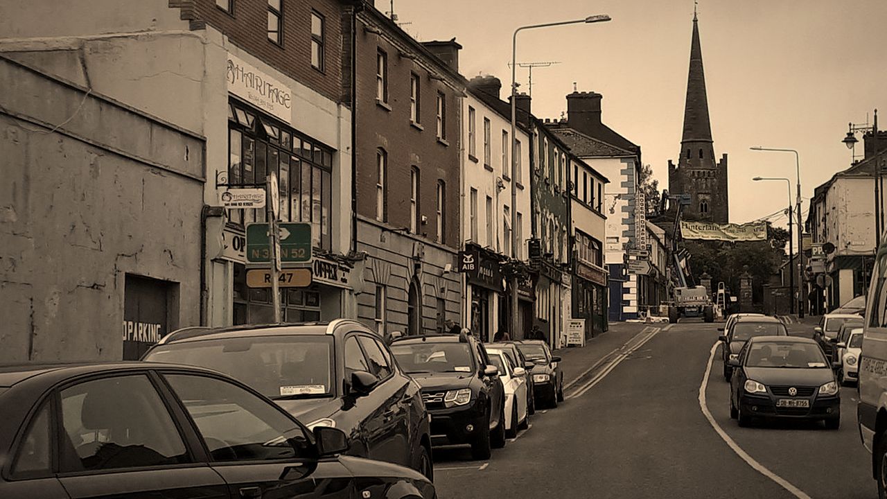 Kells town centre: a street of shopfronts rising towards the spire of St Columba’s Church